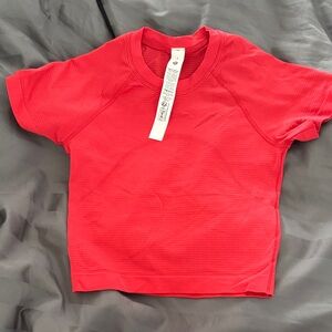 Lululemon bright red/orange top. Worn once!!! Size 2